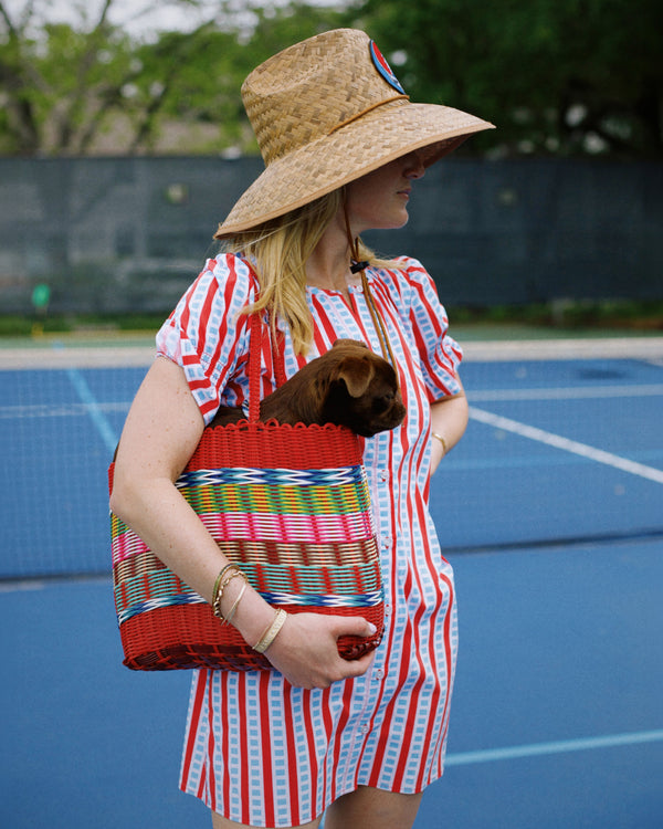 Model is wearing the Newport dress in cerulean
