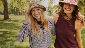 Model (left) is wearing the bainbridge quarter zip in super white/lacquer stripe. Model (right) is wearing the everyday tank in lacquer. 