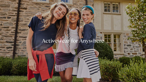 Activewear for Anywhere. Model 1 is wearing Walnut Short Sleeve in Navy with Everyday Crewneck in Poppy tied around the waist. Model 2 is wearing Palmetto Long Sleeve in White with Court Skort in Navy. Model 3 is wearing Palmetto Long Sleeve in Navy, Flounce Skort in White, with Cypress Active Sweater in Off-White/Navy Stripe tied around the waist.