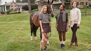 Model right is wearing the Locust Active Sweater in Chocolate/ Off White Stripe and the Flounce Skort in Chocolate. Model center is wearing the Hutton Dress in Chocolate with the Carlyle Crewneck in Chocolate/ Baby Blue Stripe over her shoulders. Model right is wearing the Ziggy Top in Cream/ Camel Stripe and the University Flare Pants in Chocolate with the Griffin Quarter Zip in Latte/ Off White Stripe around her waist.