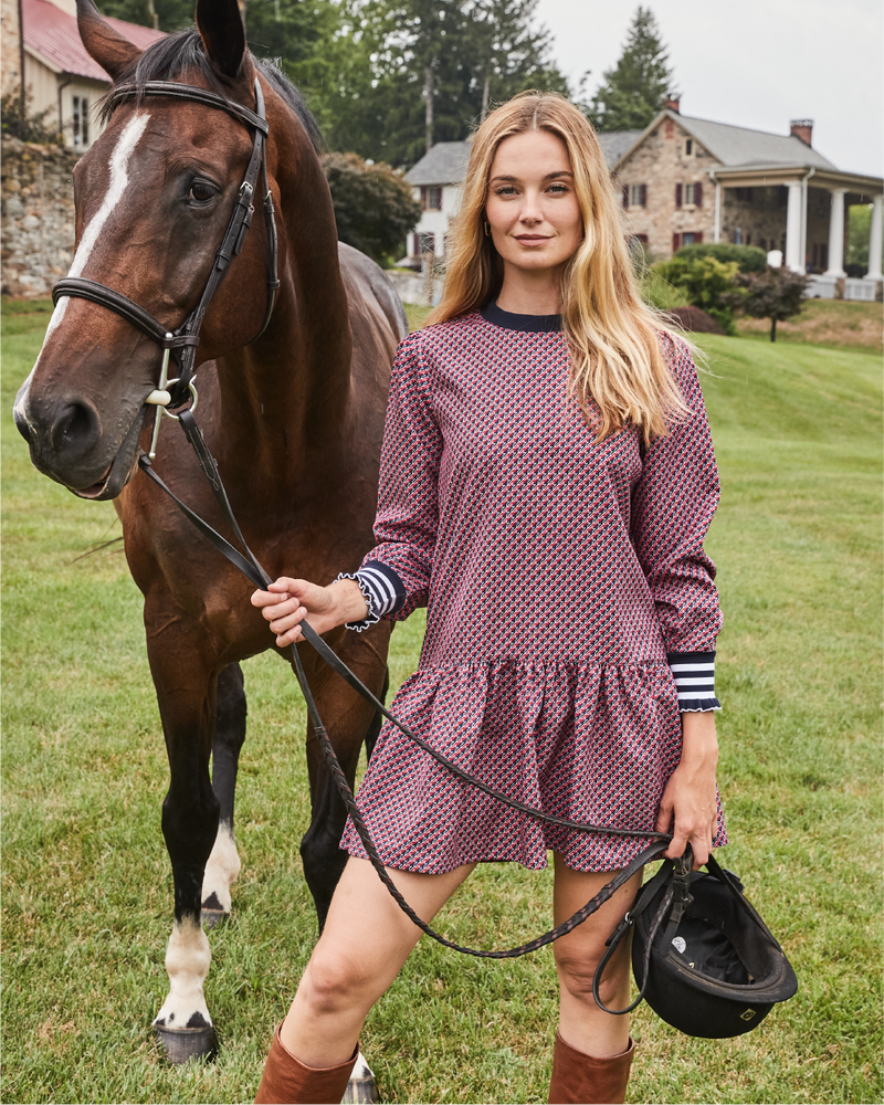 Model is wearing the Vine Dress in Navy/ Cherry Stars