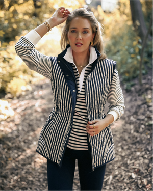 Mary Orton is wearing the Lauren Vest in Navy/ Ivory Stripe over the Annie Rugby n Ivory/ Navy Stripe with the Nico Pants in Navy.