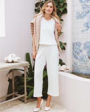Model is wearing the Lennon Top in Vintage White and the Lennon Pants in Vintage White with the Griffin Quarter Zip in Latte/Off White Stripe over her shoulders