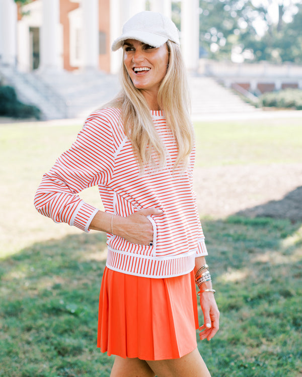 'On model product image of Scuba Light Bainbridge Crewneck in Super White/Papaya Stripe'
