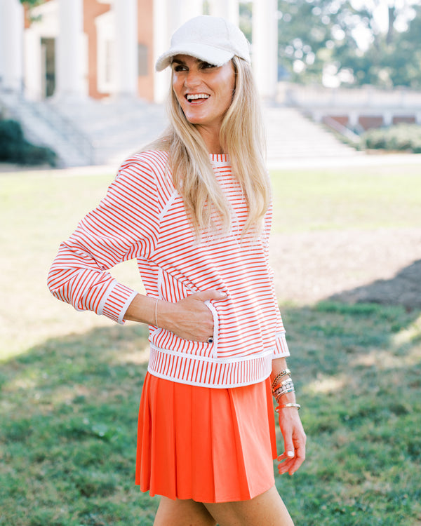 'On model product image of Scuba Light Bainbridge Crewneck in Super White/Papaya Stripe'