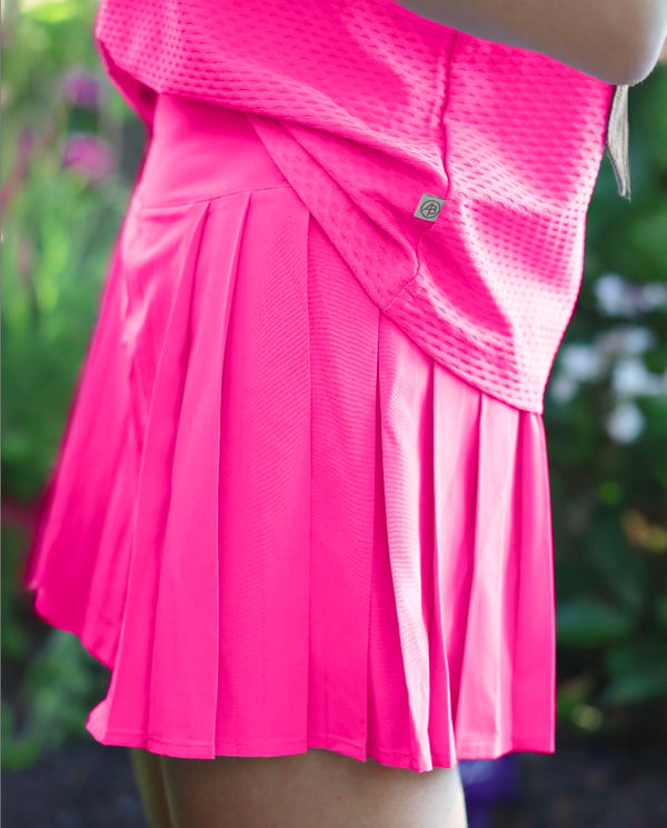 'On model product image of Sport Light 15in Baseline Skort in Bright Pink'