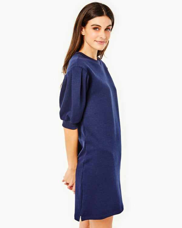 Model is wearing the cedar dress in navy.