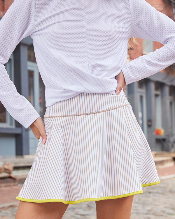 'On model product image of Smooth Sport 14.5in Circle Skort in Latte Stripe'