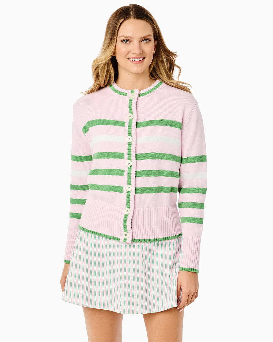 The model is wearing the coastal cardigan in super white/ matisse stripe with the racquet dress in super white