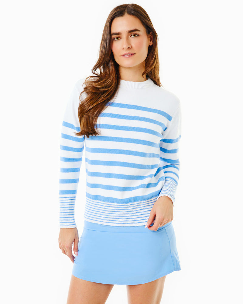 Model is wearing the Coastal Crewneck in Super White/Matisse Stripe with the Everyday Skort in Matisse
