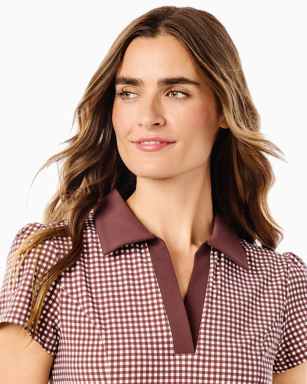 'On model product image of Smooth Sport Collared Short Sleeve Cricket Active Dress in Milk Chocolate Gingham'