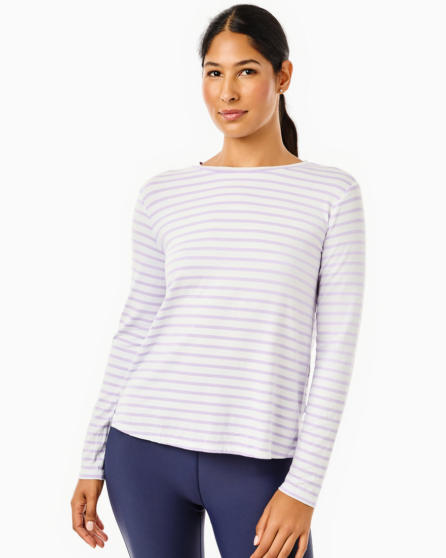 The model is wearing the everyday long sleeve in super white/ petal stripe with the flounce skort in petal