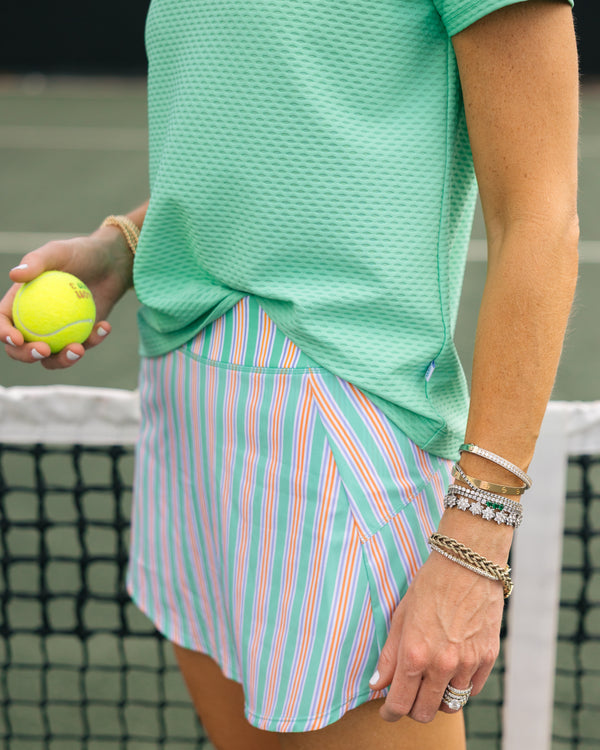 'On model product image of Sport Light 13.5in Everyday Skort in Sage Triple Stripe'