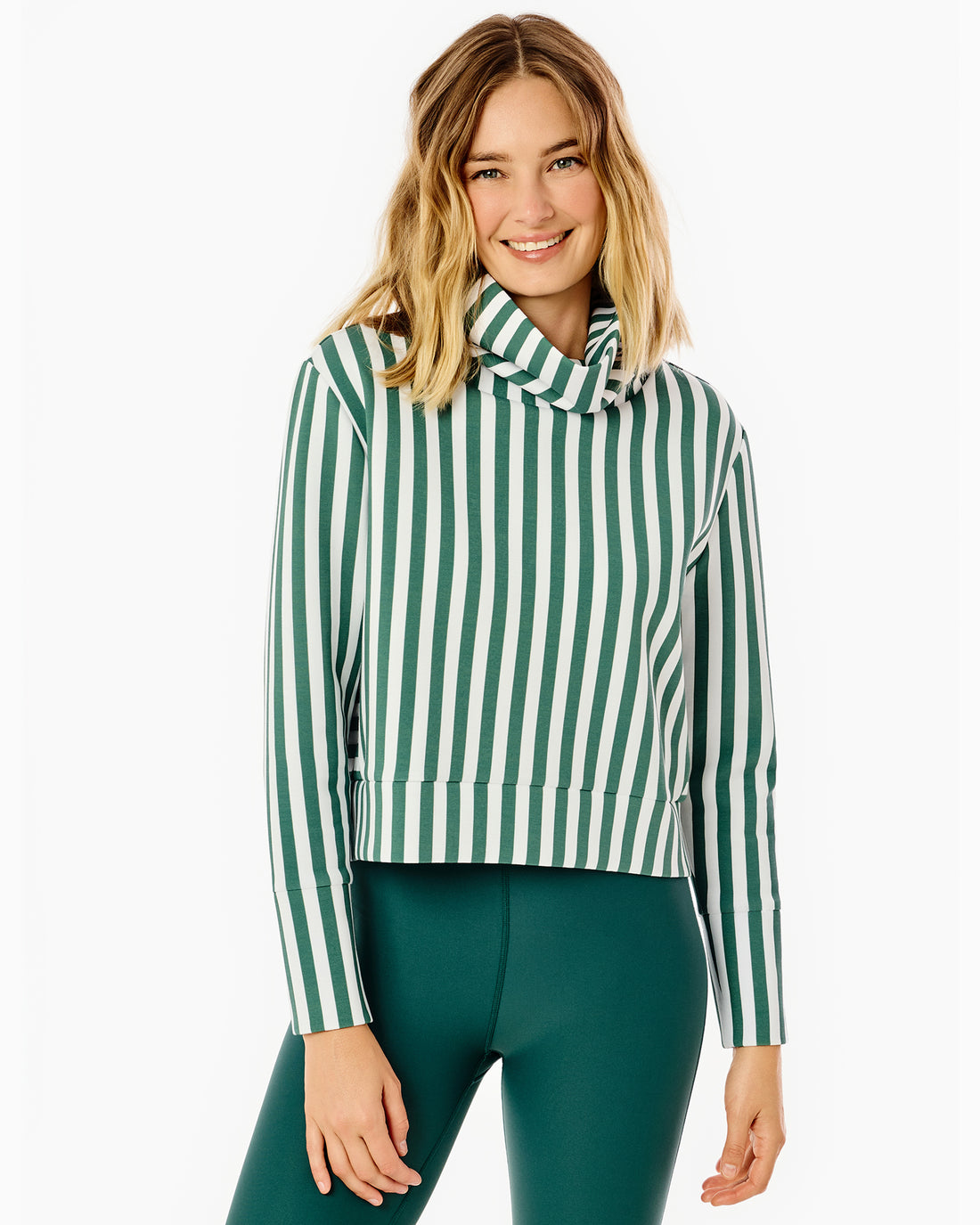 Model is wearing the Everyother Day Pullover in navy and white stripe with the Everyday Legging in beverly blue.
