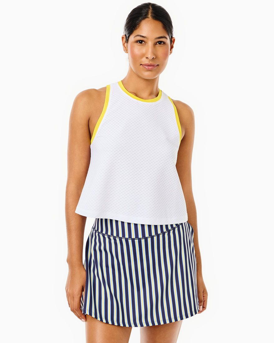 Model is wearing the everyother day tank in super white and the everyday skort in palm.