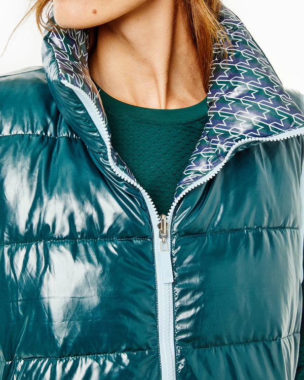 Model is wearing the Everywhere Reversible Puffer Vest in Stars Ivy with the Palmetto Long Sleeve in Ivy and the Chestnut Legging in Black