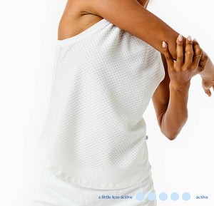 Model is wearing the Everyday Tank in Super White with the Everyday Skort in Super White