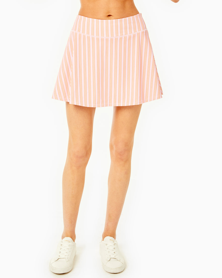 Model is wearing the Flounce Skort in peony with the Classic Short Sleeve in peony stripe.