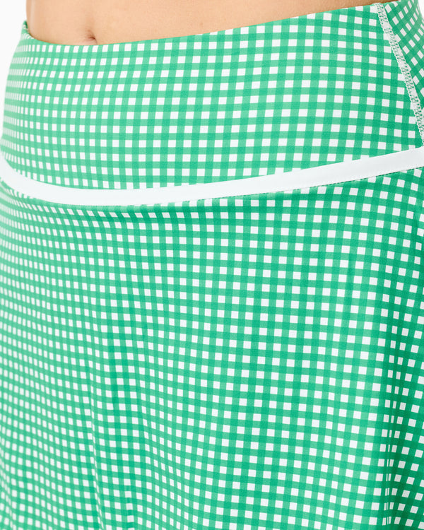 'On model product image of Smooth Sport 14.5in Founders Flounce Skort in Palm Gingham'