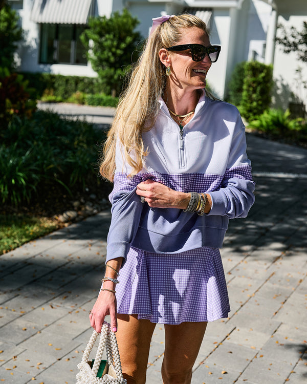 'On model product image of Smooth Sport 14.5in Highland Skort in Lavender Gingham'