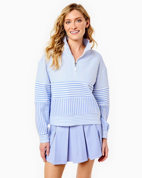 Model  is wearing the JV Quarter Zip in Super White/Violet Stripe with the Racquet Skort in Violet/Super White Stripe 