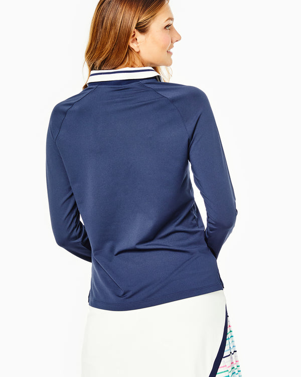 Model is wearing the key west polo in navy and the pebble beach golf skort in white with multi stripe.