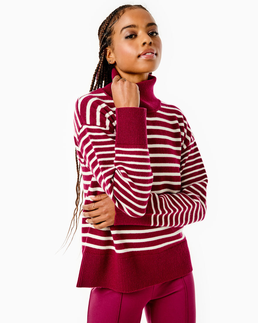 Model is waring the Kitt Sweater x Mary Orton in Burgundy/ Off White Stripe with the Nico Pants x Mary Orton in Burgundy