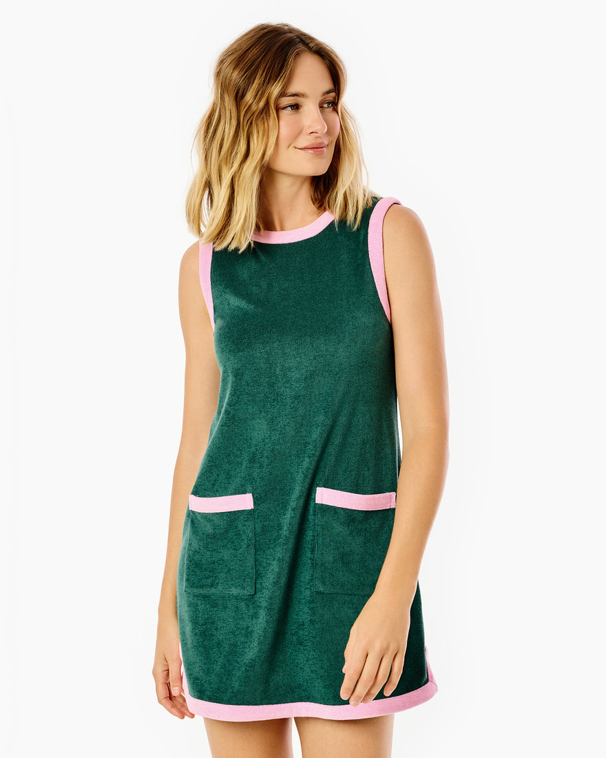 Model is wearing the lennon dress in ivy/bubblegum 