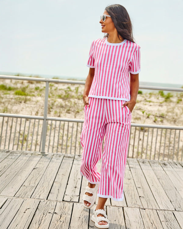 'On model product image of Lennon Wide Leg Pants in Guava Cabana Stripe'