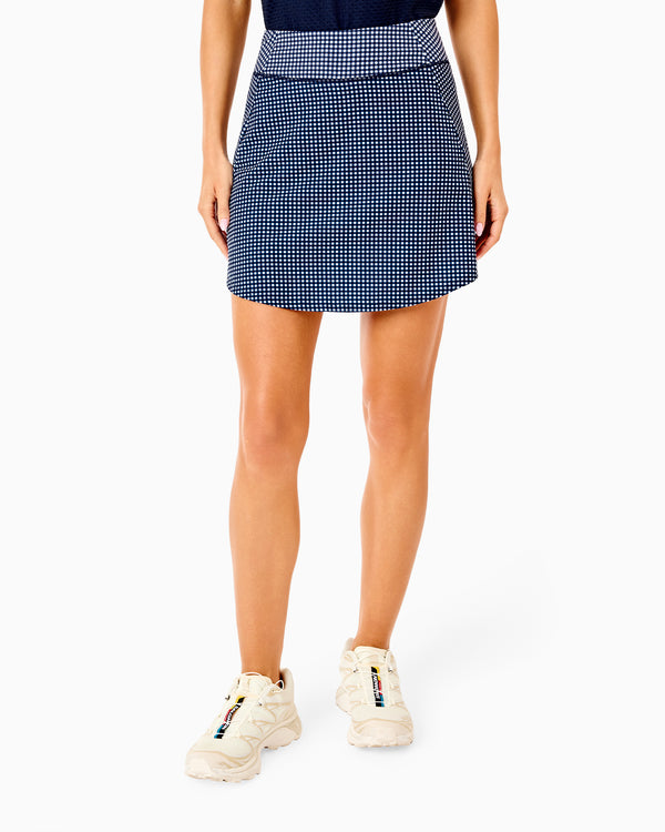 'On model product image of Sport Light 16.5in Longer Everyday Skort in Navy Gingham'
