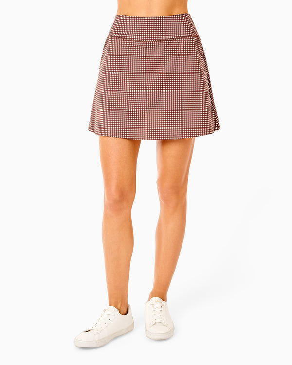 'On model product image of Smooth Sport 16in Longlined Skort in Milk Chocolate Gingham'