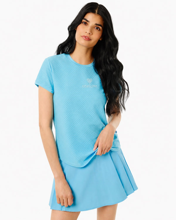 'On model product image of One Love Active Mesh Palmetto Short Sleeve Top in Vintage Blue'