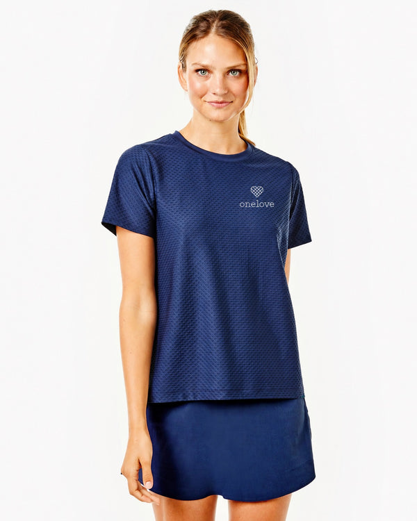 'On model product image of One Love Active Mesh Walnut Short Sleeve Top in Navy'
