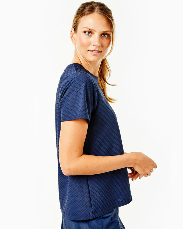 'On model product image of One Love Active Mesh Walnut Short Sleeve Top in Navy'