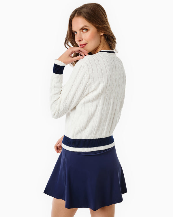 'On model product image of Cotton Cable Knit Oxford Cardigan Sweater in Super White/Navy'
