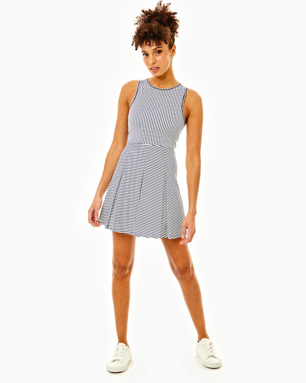 'On model product image of Smooth Sport Pleated Racquet Active Dress in Super White/Navy Stripe'