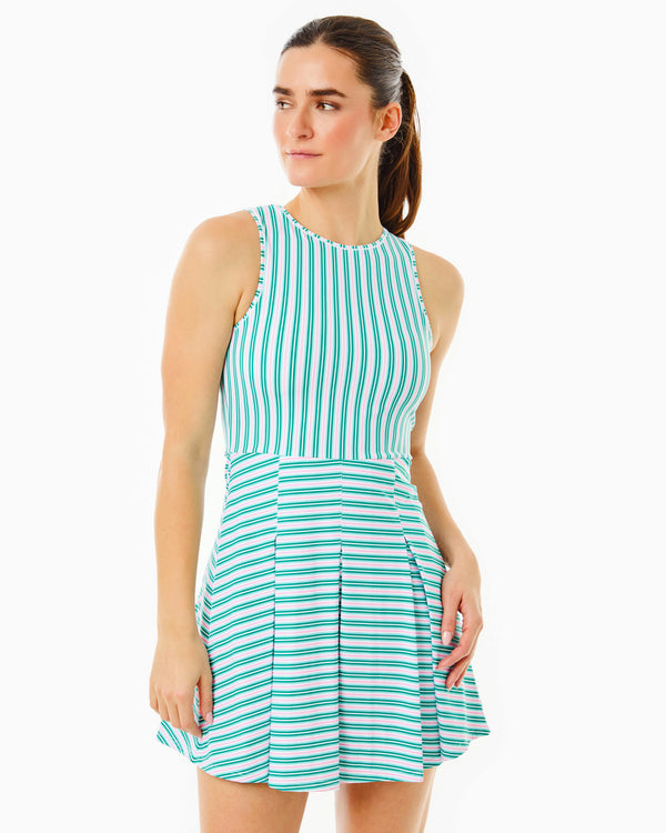'On model product image of Smooth Sport Pleated Racquet Active Dress in Watermelon Stripe'