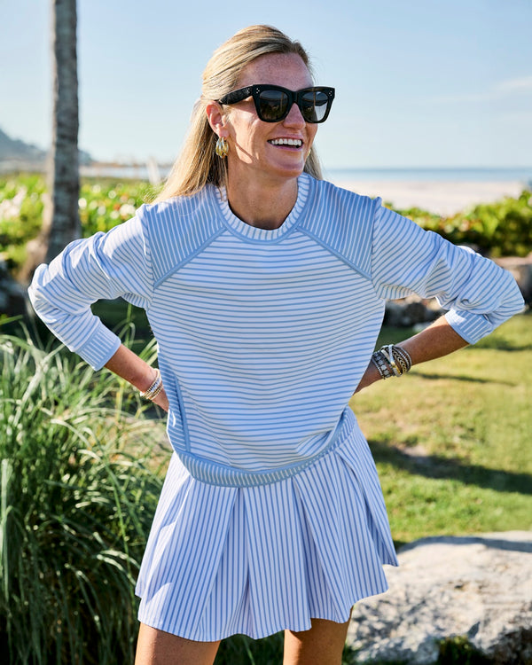 'On model product image of Smooth Sport 14in Pleated Racquet Skort in Hydrangea Stripe'