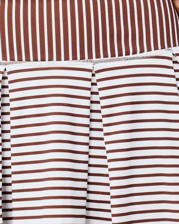 'On model product image of Smooth Sport 14in Pleated Racquet Skort in Super White/Milk Chocolate Stripe'