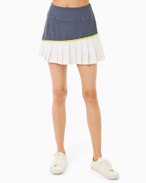 'On model product image of Mixed Smooth Sport 15in Rally Skort in Navy Gingham/Chartreuse'