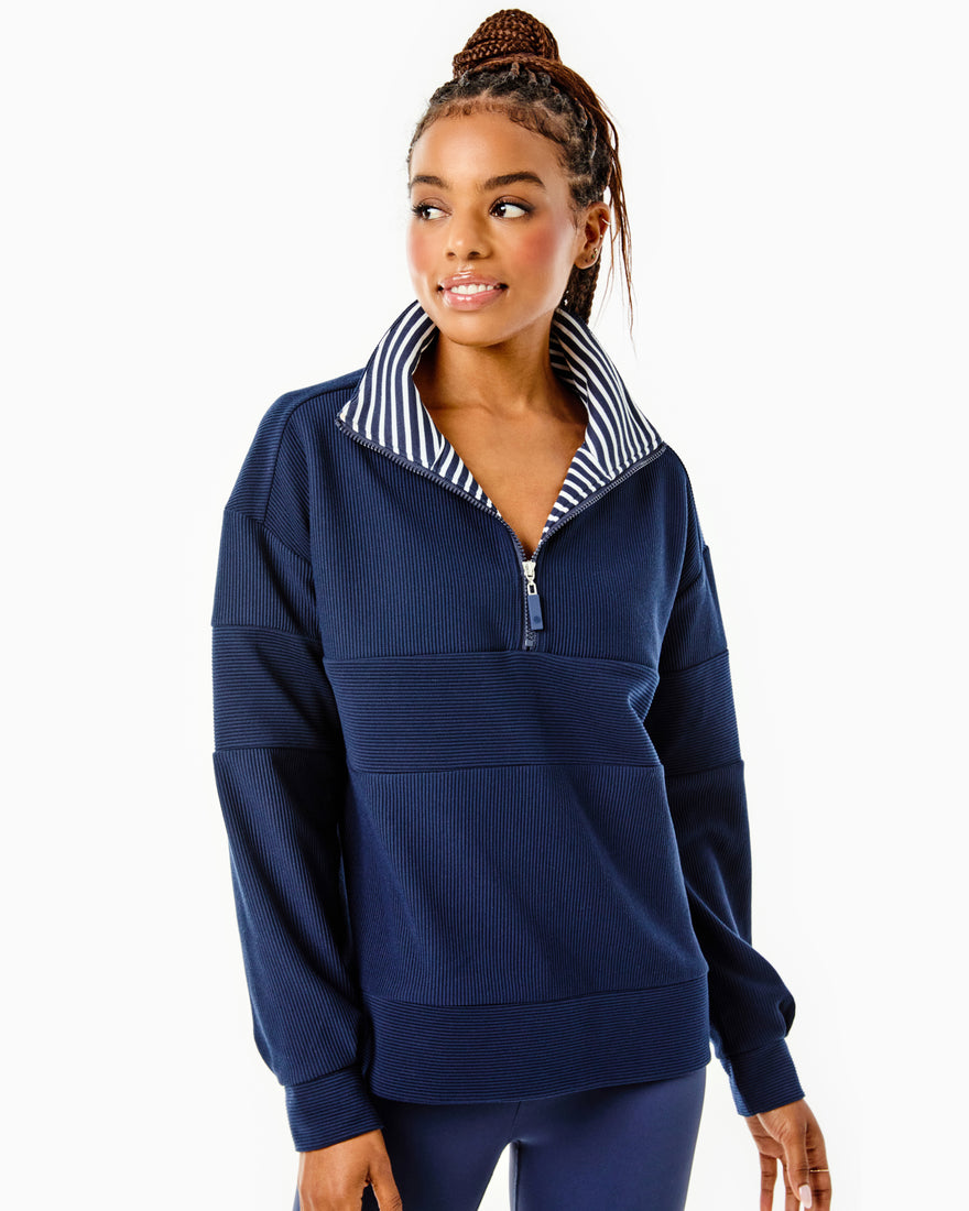 Model is wearing the Ribbed Varsity Quarter Zip in Navy with the AB Soft Legging in Navy