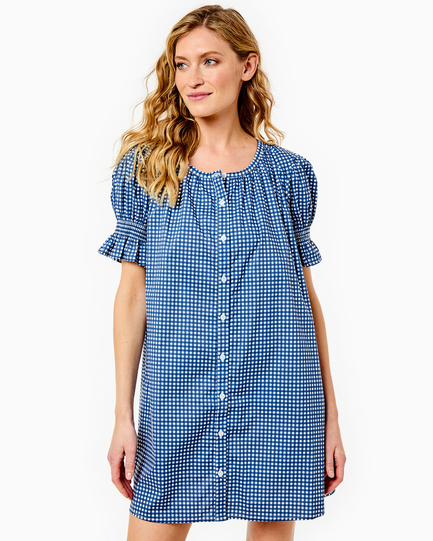 Model is wearing the sailor dress in navy.