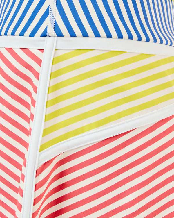 'On model product image of Smooth Sport 14in Seamed Flounce Skort in Guava/Cerulean/Chartreuse Stripe'