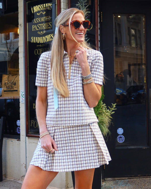 'On model product image of Ponte Virginian Pleated 14.25in Skort in Painted Plaid'