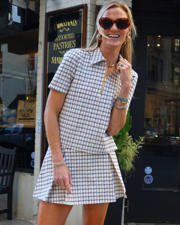 'On model product image of Ponte Virginian Polo Top in Painted Plaid'