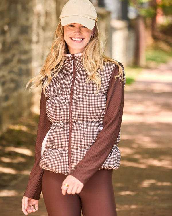 'On model product image of Puffer Whitfield Vest in Milk Chocolate Gingham'