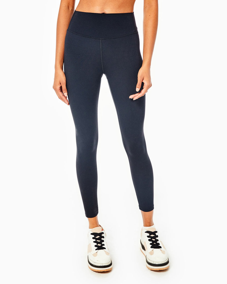 Model is wearing the AB soft leggings in olive.