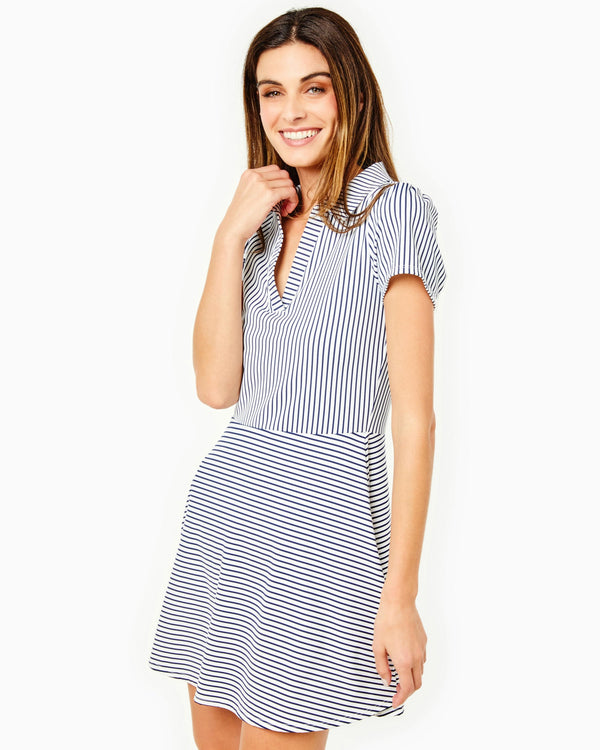 'On model product image of Smooth Sport Collared Short Sleeve Cricket Active Dress in Navy/White Stripes'