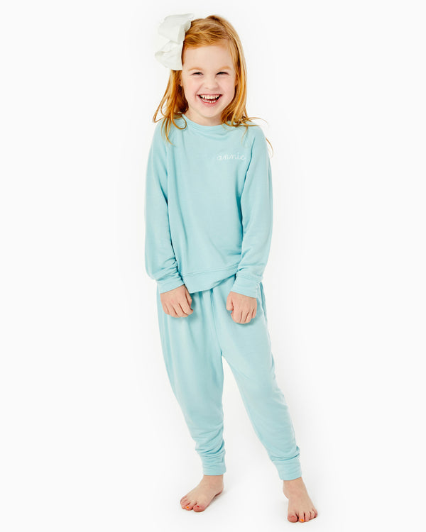 'On model product image of Kids Lovie Sweatshirt in Light Blue'