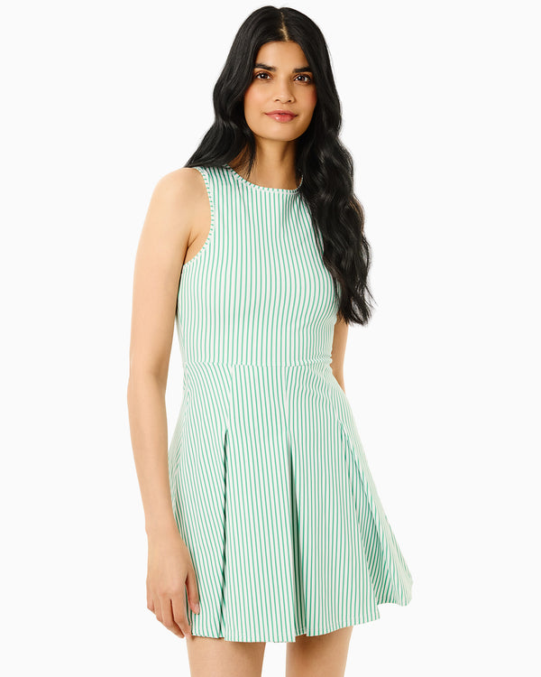 'On model product image of Smooth Sport Pleated Racquet Active Dress in Super White/Palm Stripes'